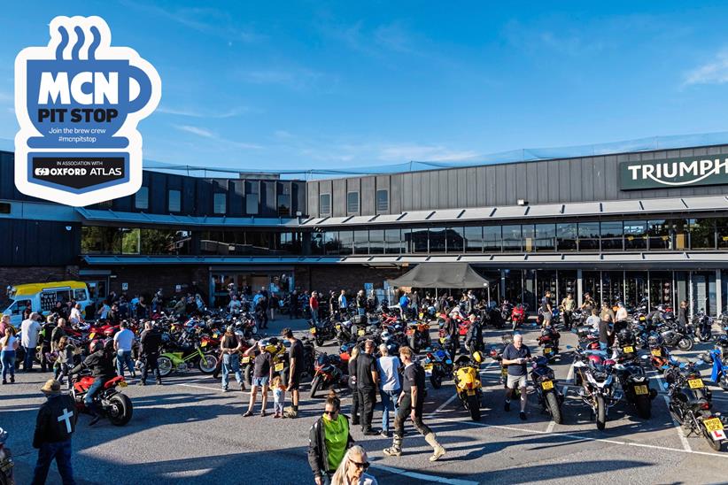 Motorcycles filling the forecourt outside a Triumph dealership
